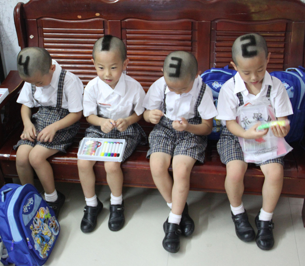 Mother has numbers shaved into hair of quadruplet sons, Shenzhen, Guangdong Province, China - 03 Sep 2012