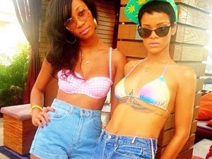 Rihanna shows off new tattoo in bikini photo - and then hits gun range