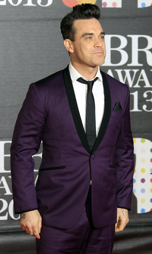 Robbie Williams rocks up to BRIT Awards in purple suit: pictures ...