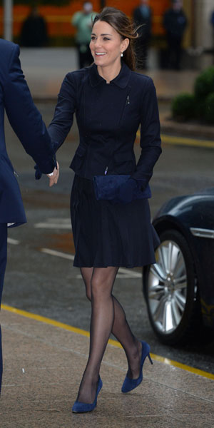 Kate Middleton's pleated skirt battles wind on Place2Be visit: photos ...