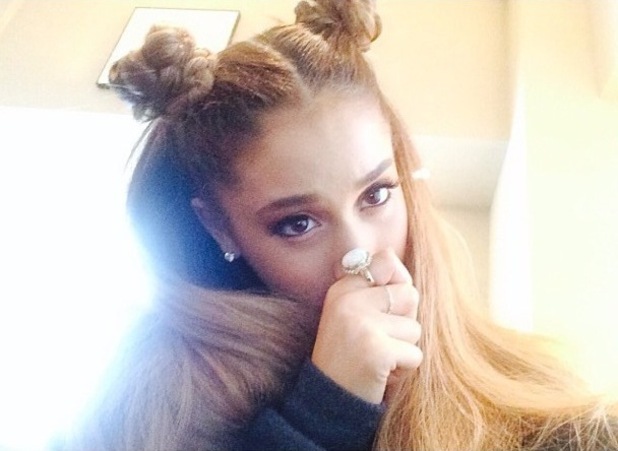 Ariana Grande switches her trademark hairstyle for braided topknots ...