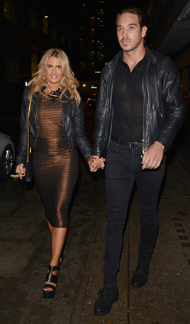 Danielle Armstrong and James Lock sport matching jackets in London ...